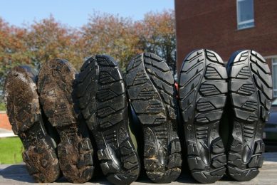 Simple procedures like cleaning (middle pair) and disinfecting (right pair) your boots have huge impact on the amount of bacteria that gets transferred between production stages. Photo: Prof Jeroen Dewulf