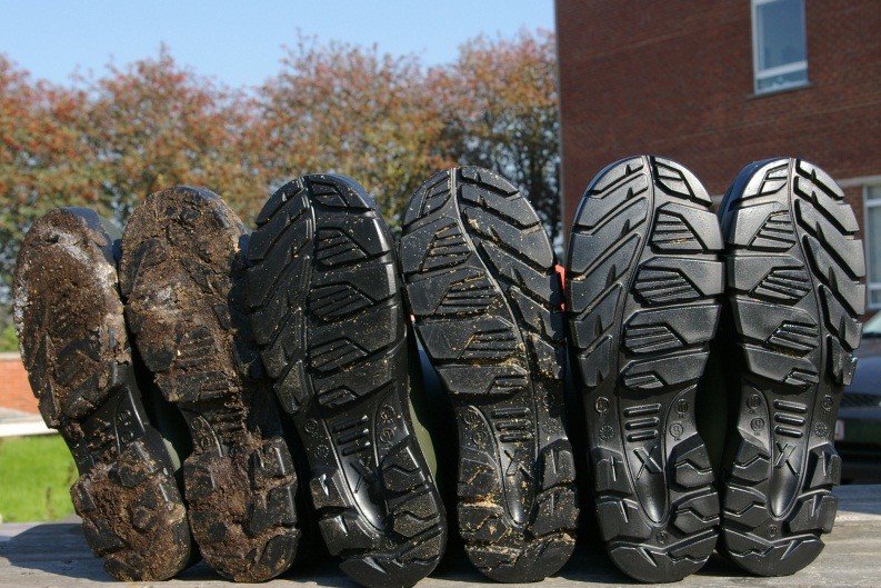 Simple procedures like cleaning (middle pair) and disinfecting (right pair) your boots have huge impact on the amount of bacteria that gets transferred between production stages. Photo: Prof Jeroen Dewulf