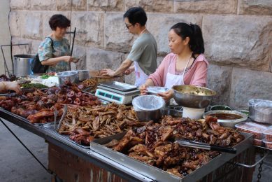 A rapidly disappearing sight in China? Pork sales at the road side in downtown Chongqing. Photo: Vincent ter Beek