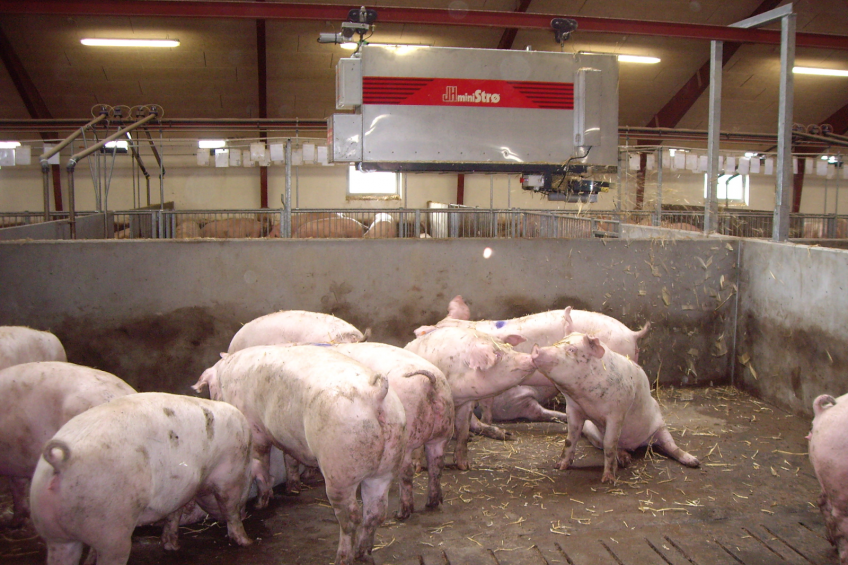 Dispersing straw from a rail above