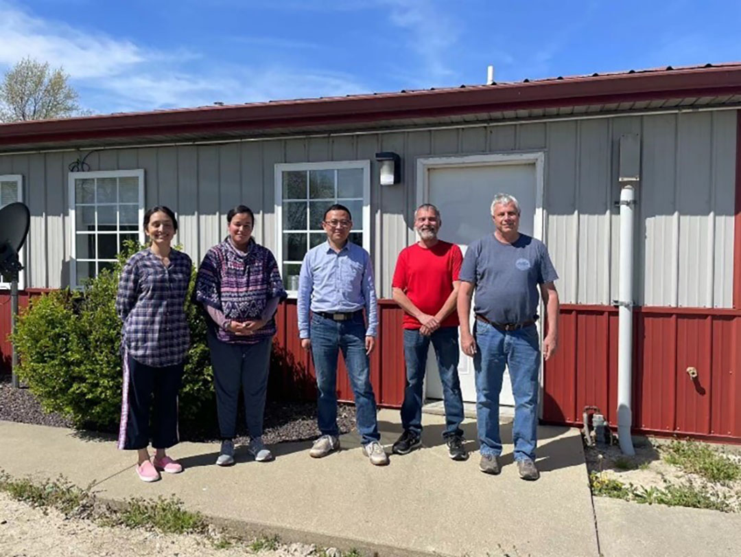 Acuity China representative Du Lin (centre) visits Acuity boar stud in Carlyle IL. Photo: ACUITY